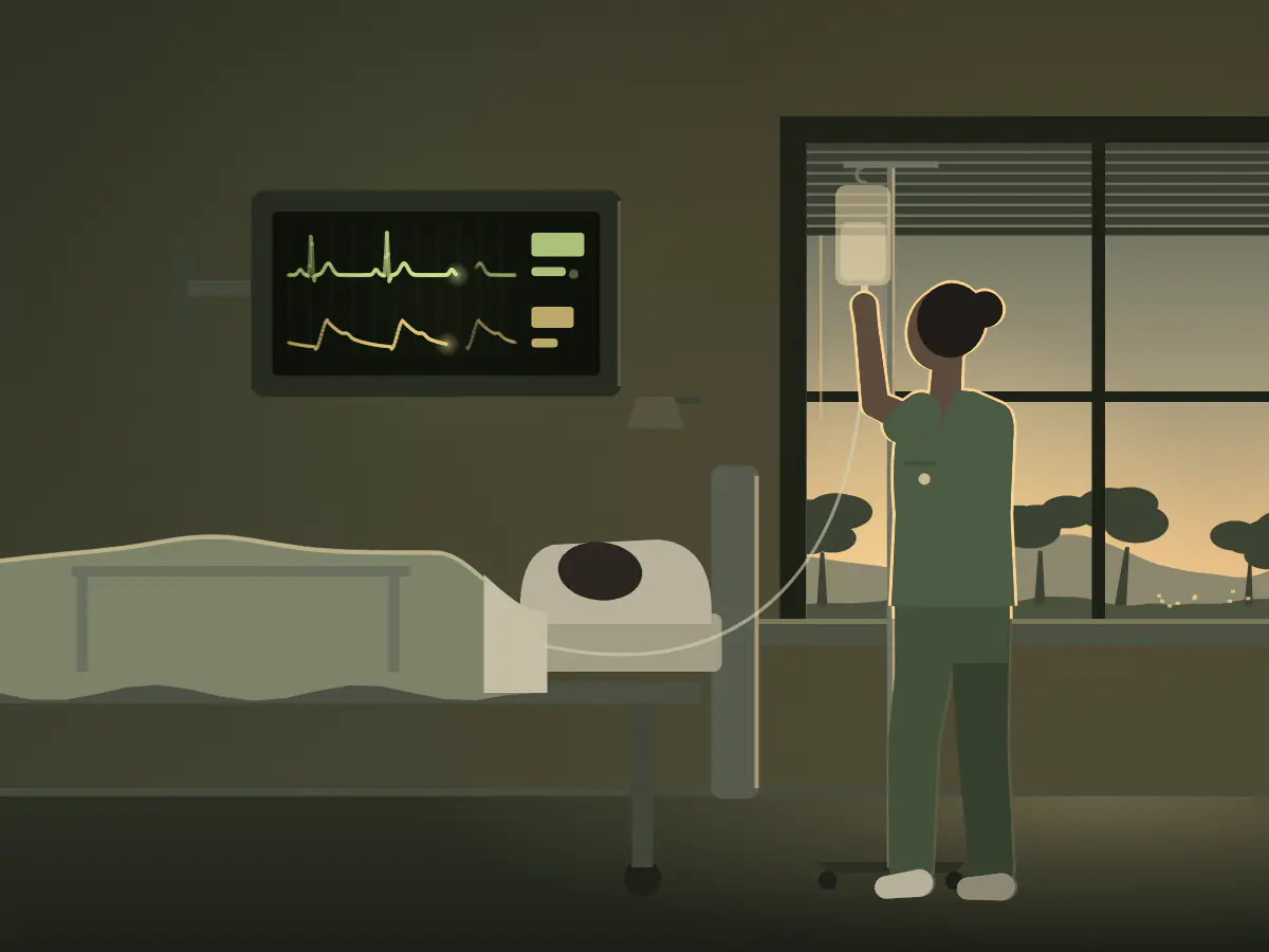 A nurse checks a drip beside a hospital bed, paddocks outside the ward window.