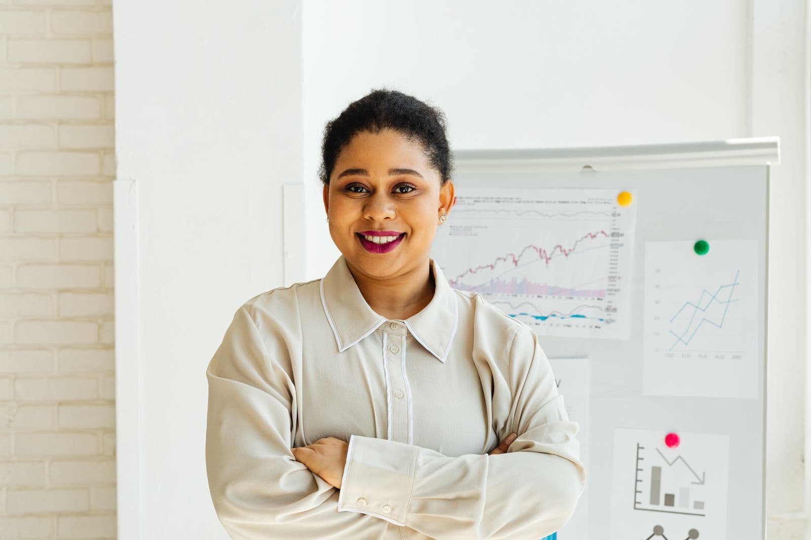 A businesswoman standing confidently in a modern office