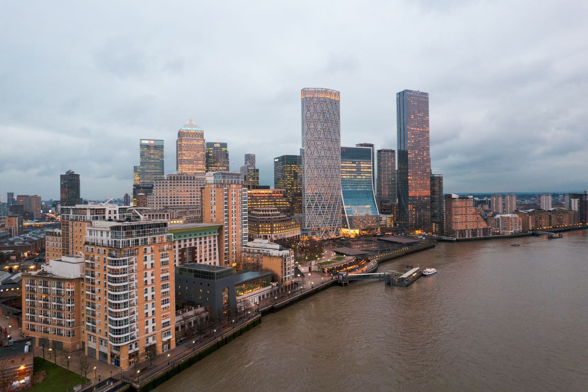 Aerial view of Canary Wharf and the River Thames at dusk