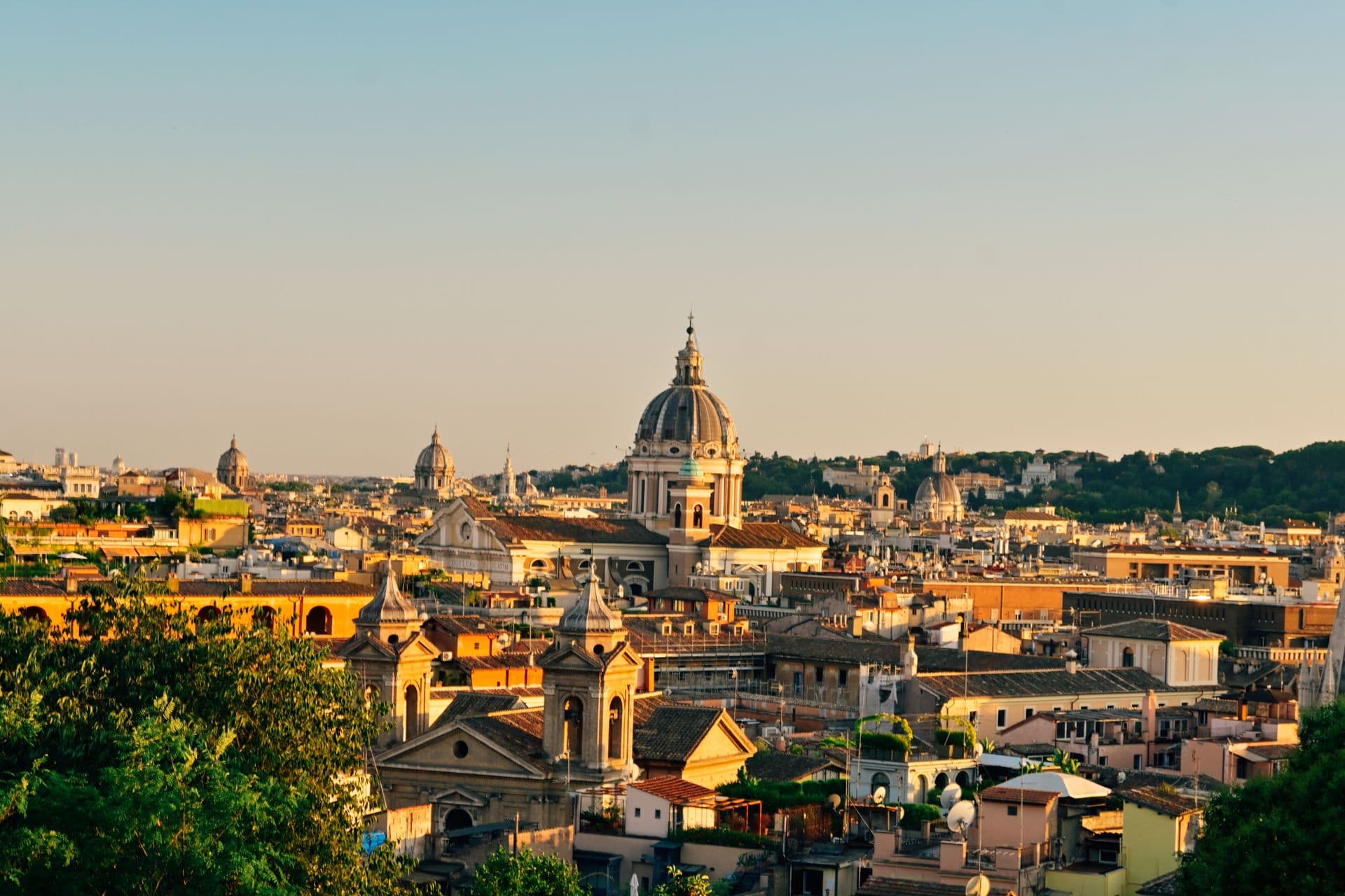 The Rome skyline of domes and rooftops at sunset